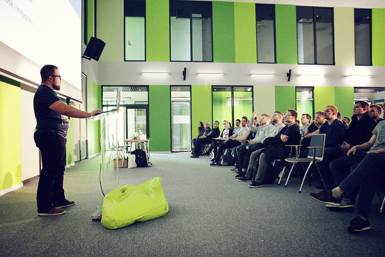 Maciej speaking at a conference
